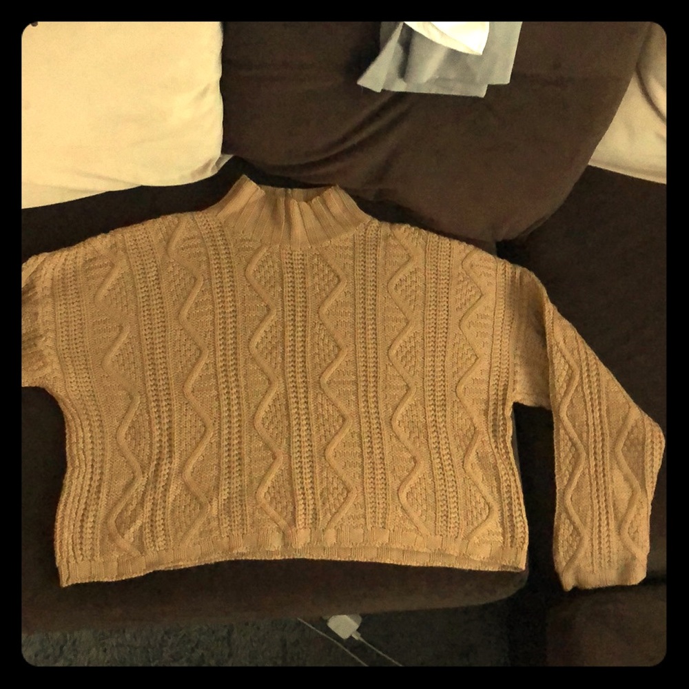 Sweater with short midriff.